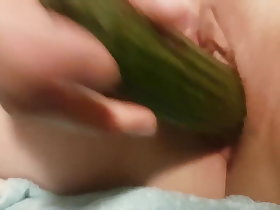 Carrying-on close to a cucumber
